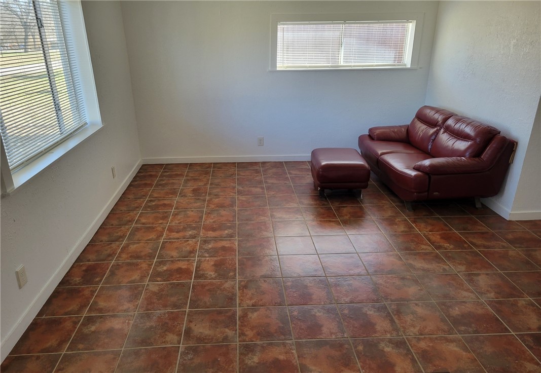 415 8th Street Bandera, TX 78003 - Photo 4 of 13 a living room with furniture and a rug