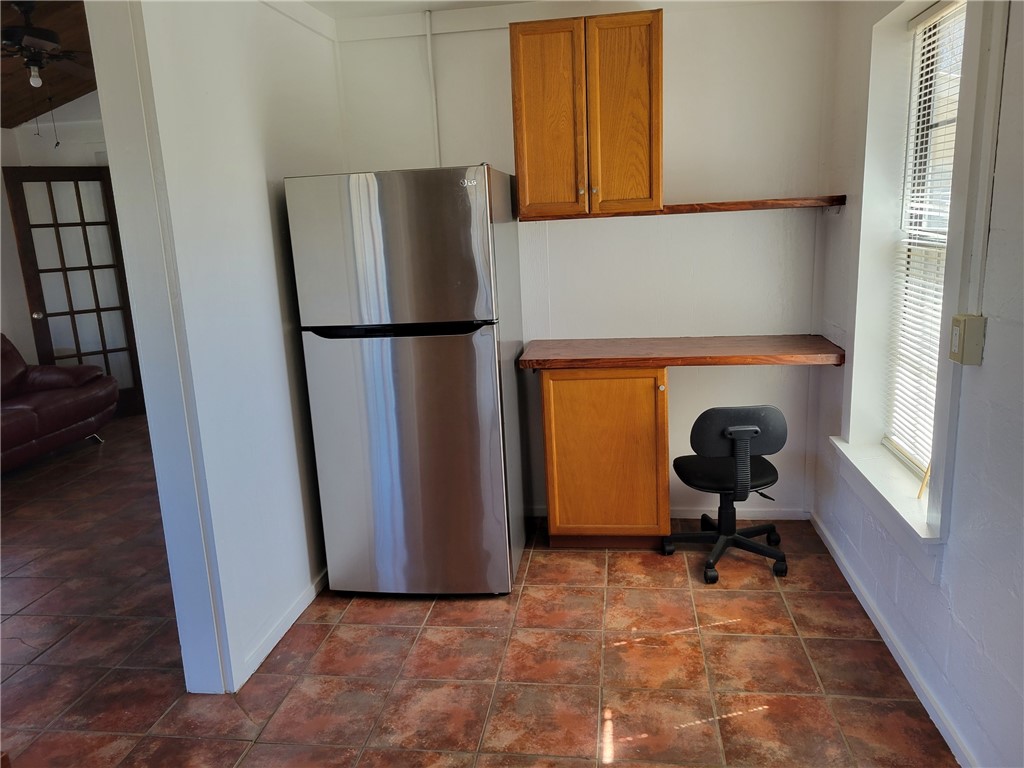 415 8th Street Bandera, TX 78003 - Photo 10 of 13 a view of a refrigerator a washer and dryer in a room