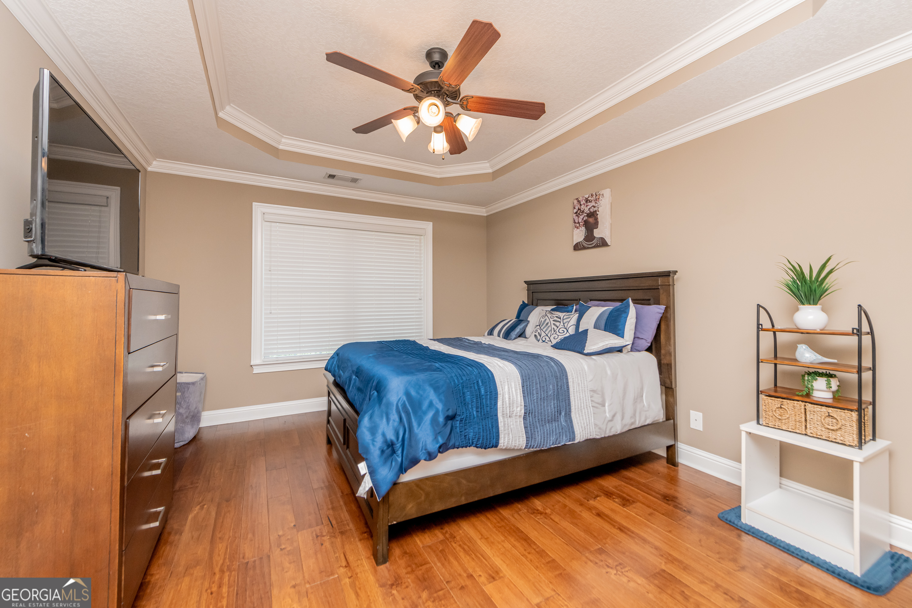 405 Old Bridge Road Warner Robins, GA 31088 - Photo 43 of 55 a bedroom with a bed and a chandelier
