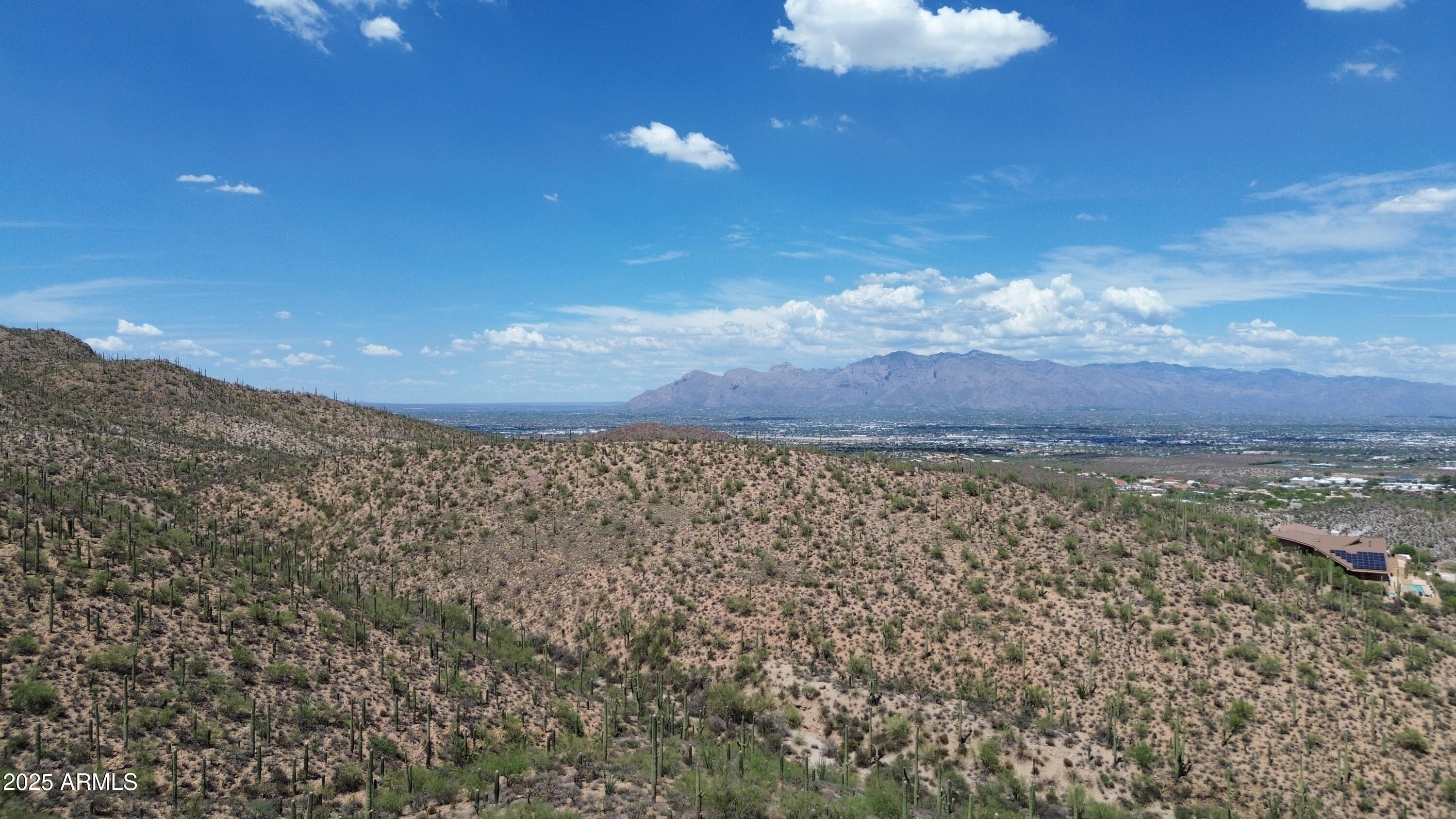 485 South Hotel Service Road Tucson, AZ 85745 - Photo 15 of 38 a view of a dry yard with mountains in the background