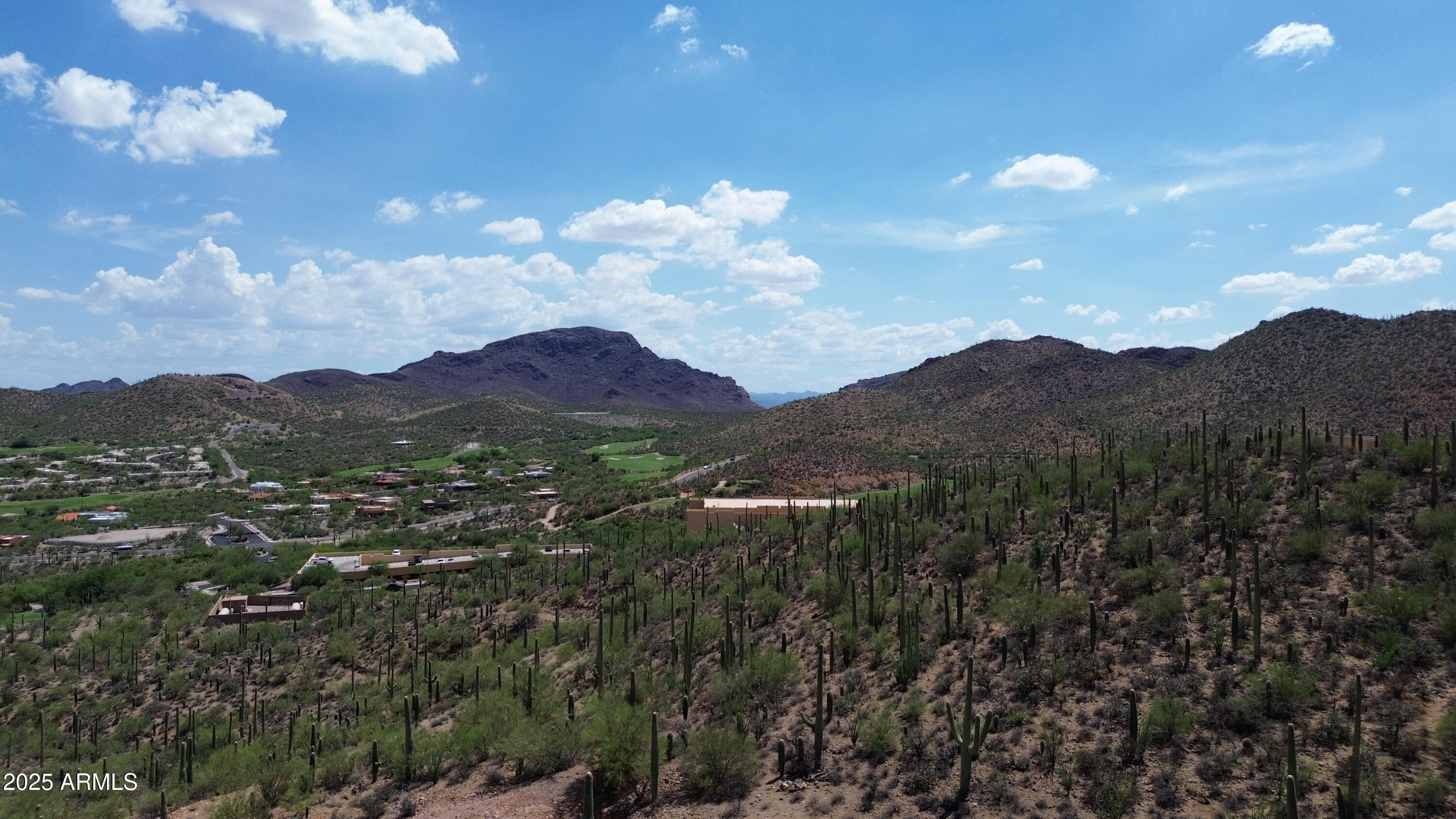 485 South Hotel Service Road Tucson, AZ 85745 - Photo 27 of 38 a view of a house with a mountain in the background