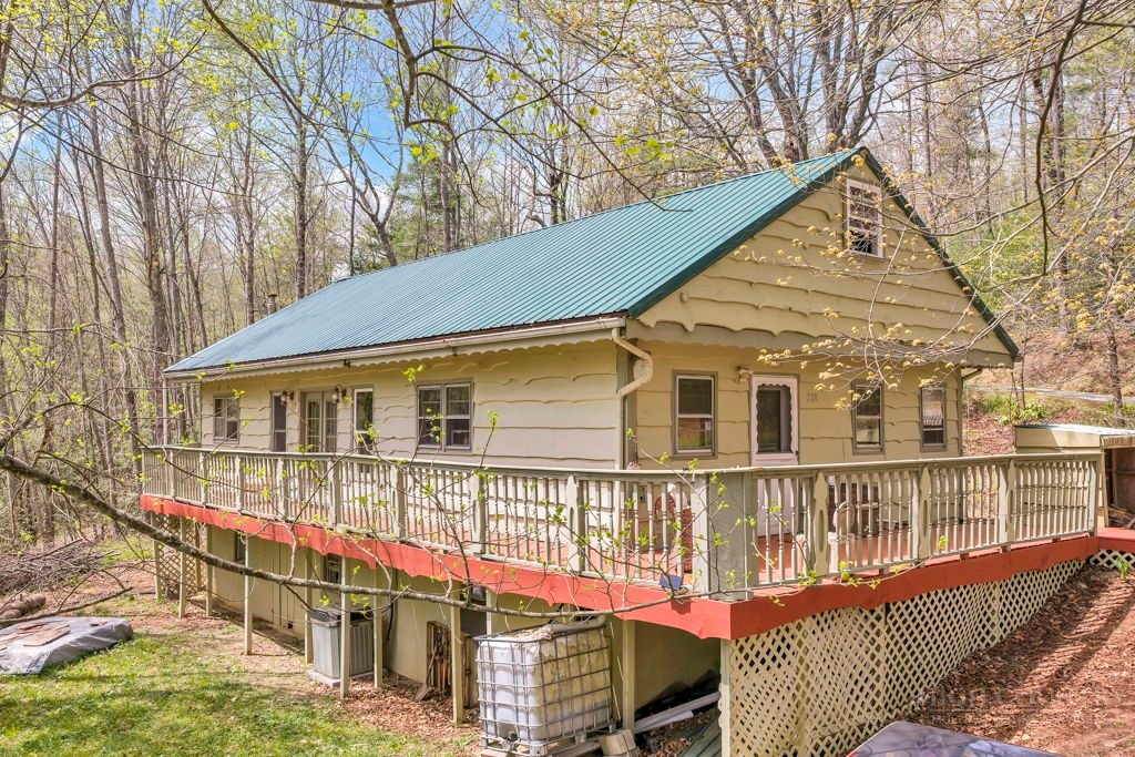 a view of a house with a wooden deck