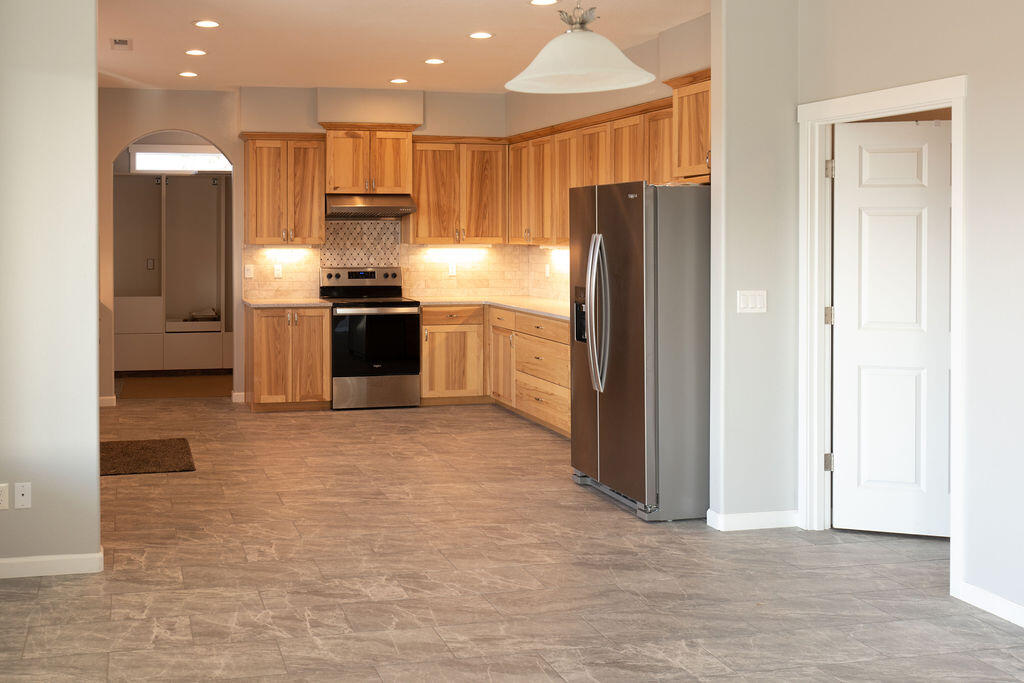 23775 Dodds Road Bend, OR 97701 - Photo 11 of 67 Open dining and kitchen are perfect for entertaining with easy access to laundry room.