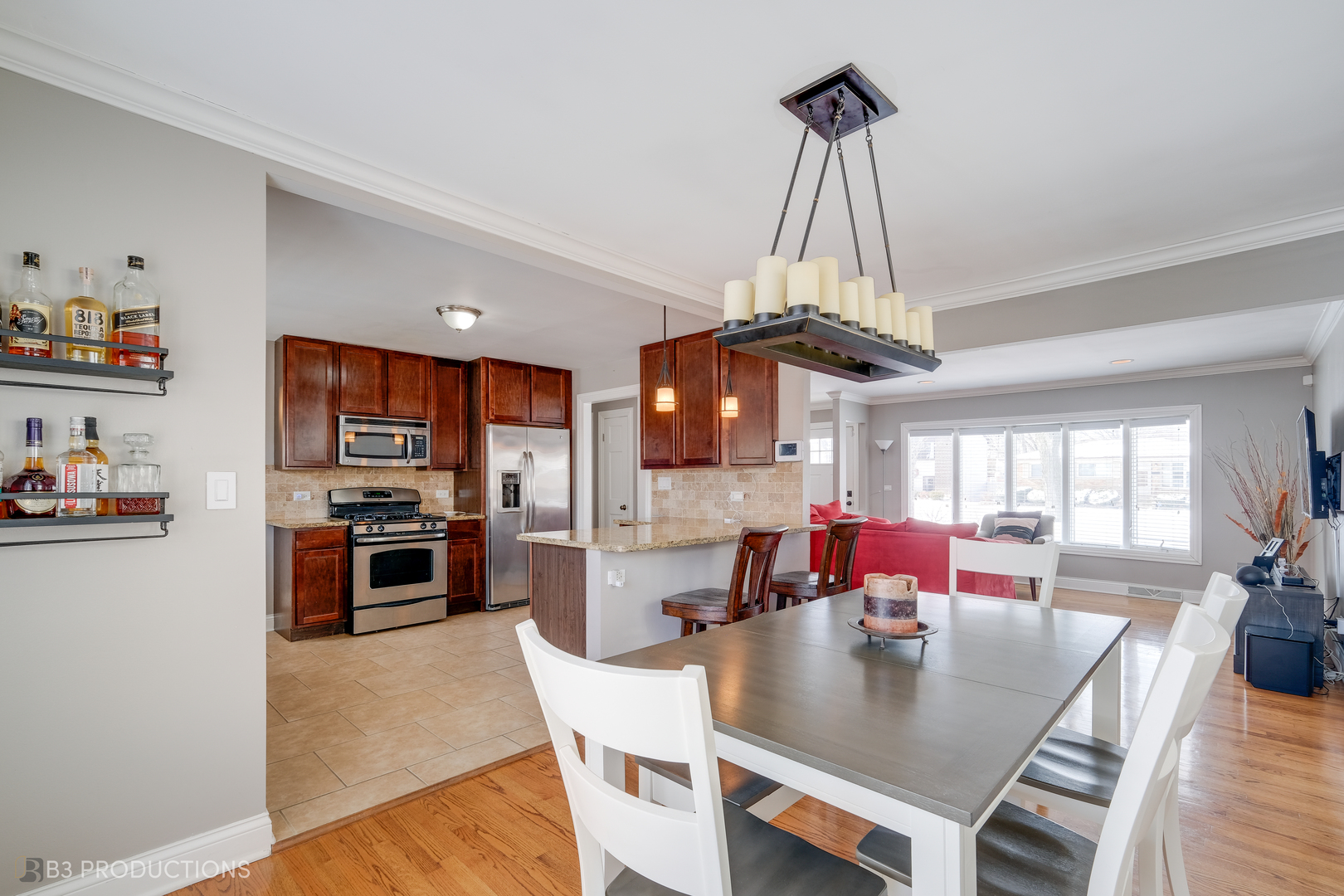 1415 South Chestnut Drive Mount Prospect, IL 60056 - Photo 8 of 15 a view of a dining room and livingroom with furniture wooden floor a chandelier