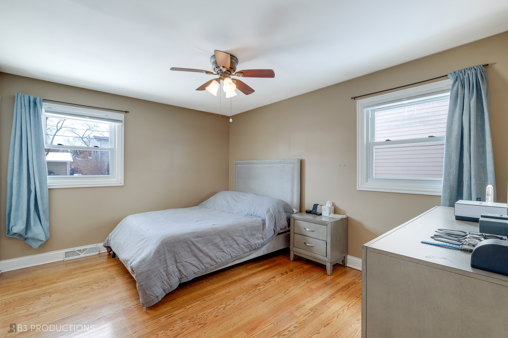 1415 South Chestnut Drive Mount Prospect, IL 60056 - Photo 10 of 15 a bedroom with a bed and a chandelier