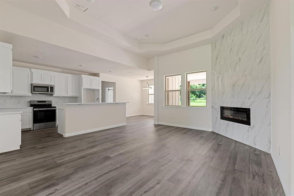 180 Nix Drive Emory, TX 75440 - Photo 6 of 17 a view of a kitchen with microwave and stove top oven