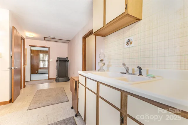 an aerial view of a house with outdoor space