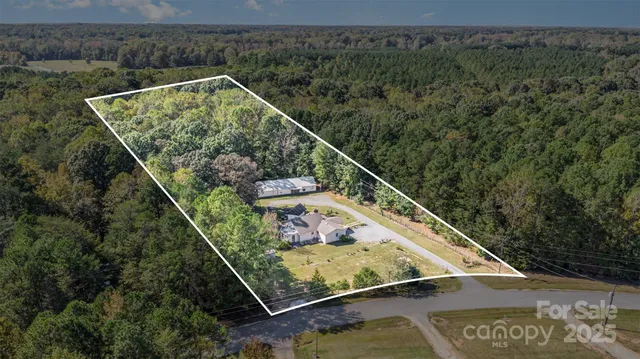 a balcony with furniture and garden view
