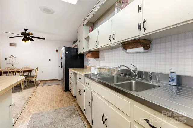 a view of a house with backyard porch and sitting area