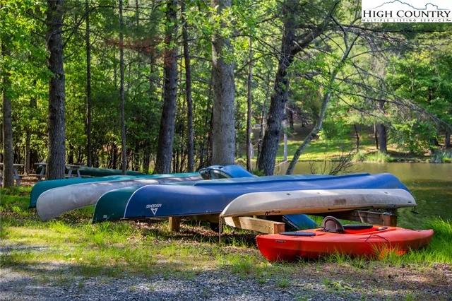 a swimming pool with outdoor seating and yard