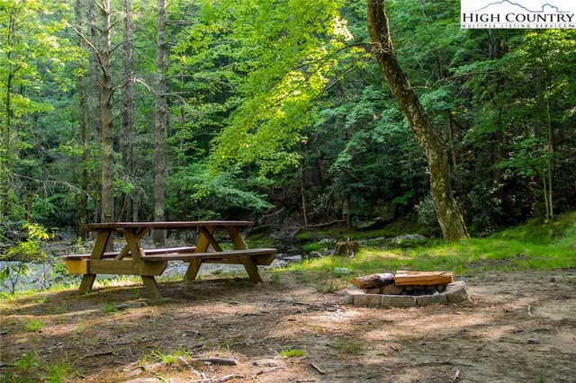a view of an outdoor sitting area with fire pit