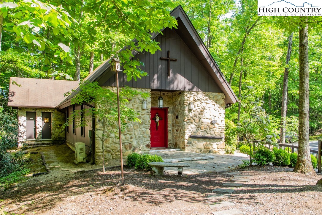 Lot94-95 Roaring Ridge Road Deep Gap, NC 28618 - Photo 9 of 17 a front view of a house with garden