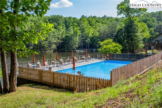 a view of a backyard with sitting area