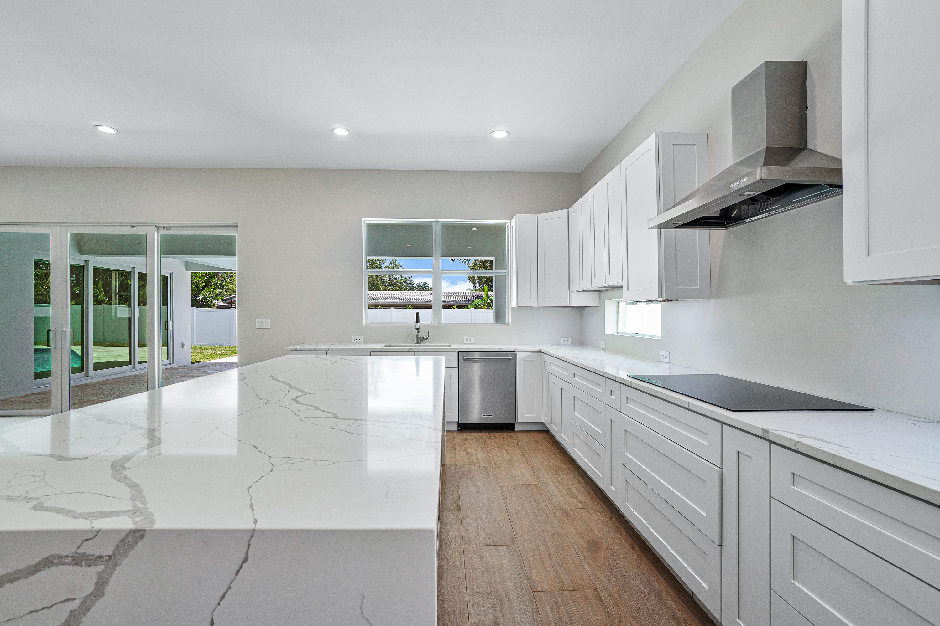 132 Southwest 7th Terrace Boca Raton, FL 33486 - Photo 8 of 39 a large kitchen with stainless steel appliances lots of counter space and a sink