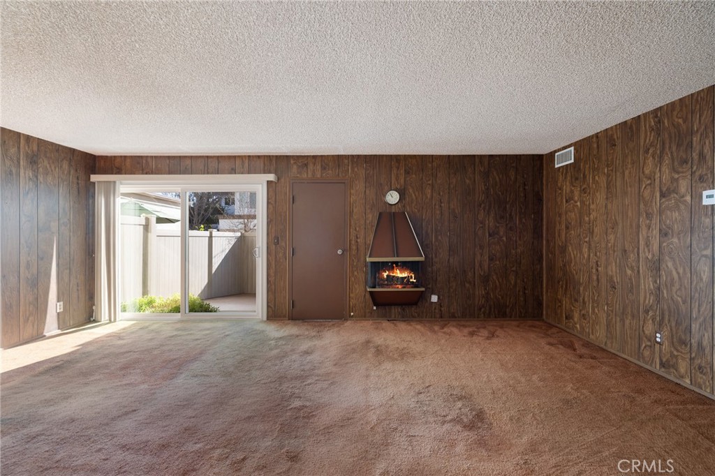 10140 Larwin Avenue, Unit 3 Chatsworth, CA 91311 - Photo 10 of 36 This is the family room area with fireplace and view of the back patio
