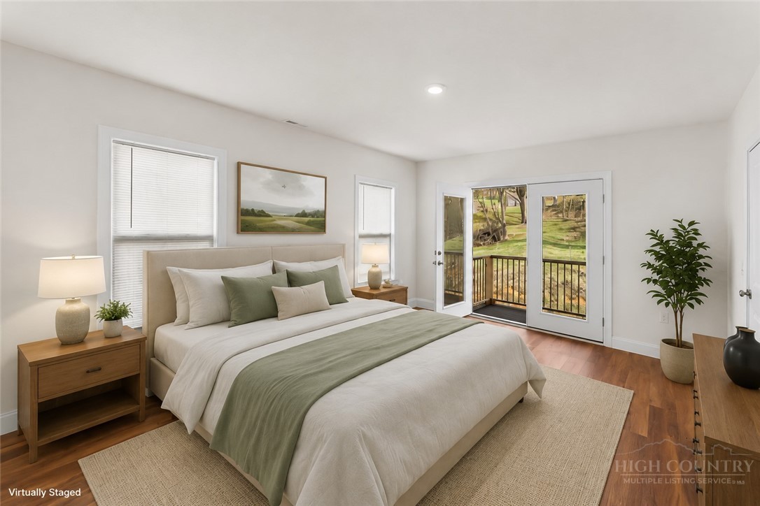 262 Old Bristol Road Boone, NC 28607 - Photo 7 of 26 a spacious bedroom with a large bed and a large window