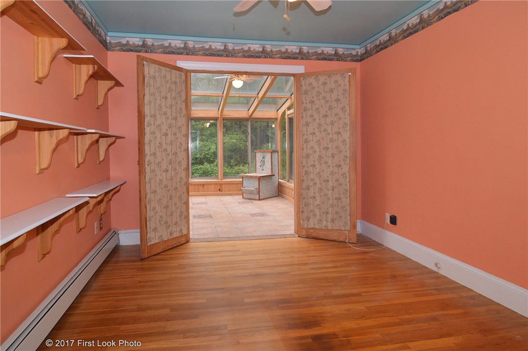 1323 S Road South Kingstown, RI 02879 - Photo 19 of 39 Master bedroom opens up to a sun room