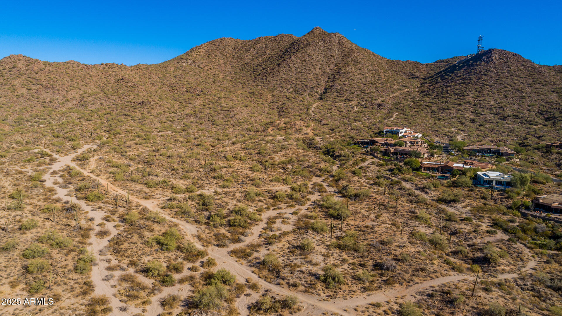 4037 North Pinnacle Hills Circle Mesa, AZ 85207 - Photo 137 of 195 a view of a large building with mountains in the background