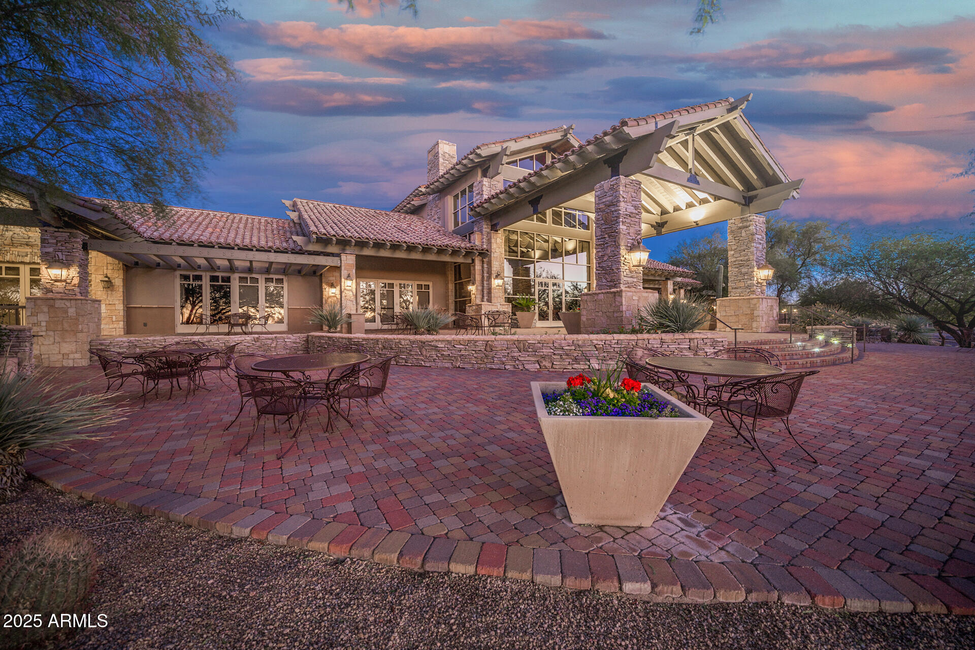 4037 North Pinnacle Hills Circle Mesa, AZ 85207 - Photo 166 of 195 a view of a patio with table and chairs and potted plants