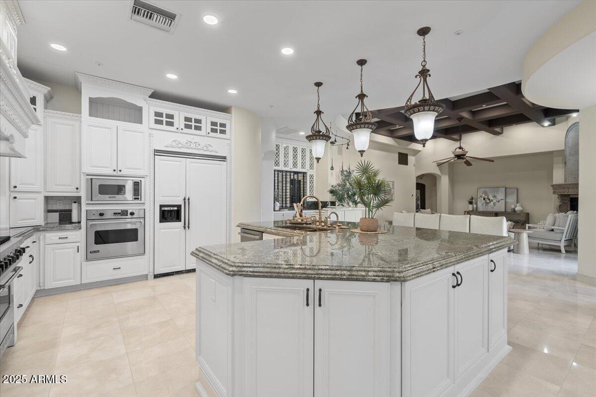 4037 North Pinnacle Hills Circle Mesa, AZ 85207 - Photo 21 of 195 a kitchen with stainless steel appliances granite countertop a sink a stove and a refrigerator
