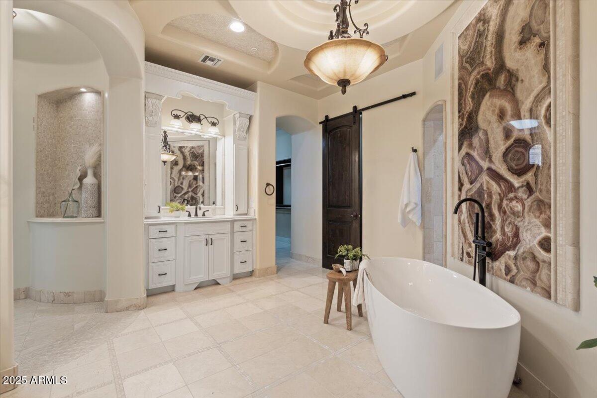 4037 North Pinnacle Hills Circle Mesa, AZ 85207 - Photo 36 of 195 a spacious bathroom with a bathtub shower sink and mirror