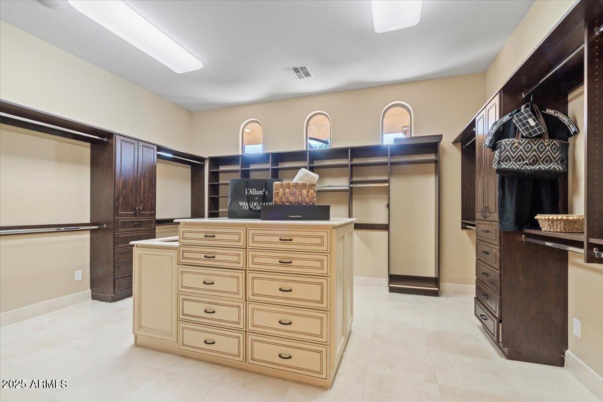 4037 North Pinnacle Hills Circle Mesa, AZ 85207 - Photo 39 of 195 a view of kitchen with stainless steel appliances kitchen island granite countertop a refrigerator and cabinets