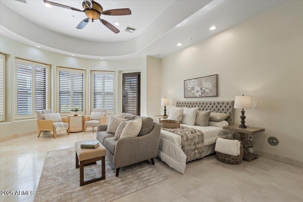 4037 North Pinnacle Hills Circle Mesa, AZ 85207 - Photo 60 of 195 a spacious bedroom with a bed and glass walk in closet