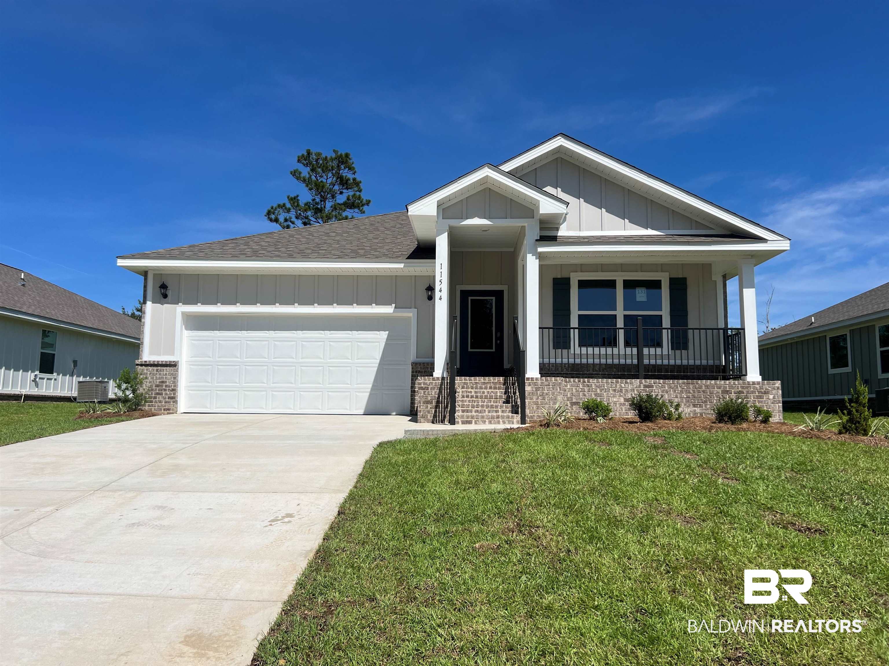 11544 Elemis Drive Daphne, AL 36526 - Photo 1 of 9 Craftsman-style home featuring a garage and a front lawn
