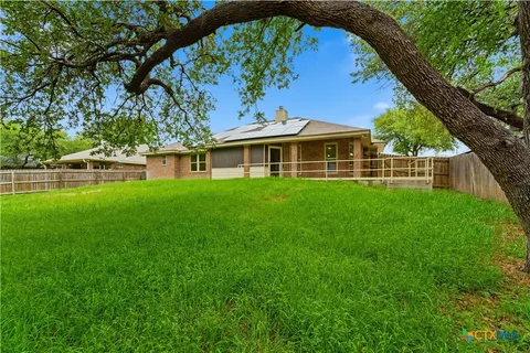 a view of a house with a yard porch and sitting area