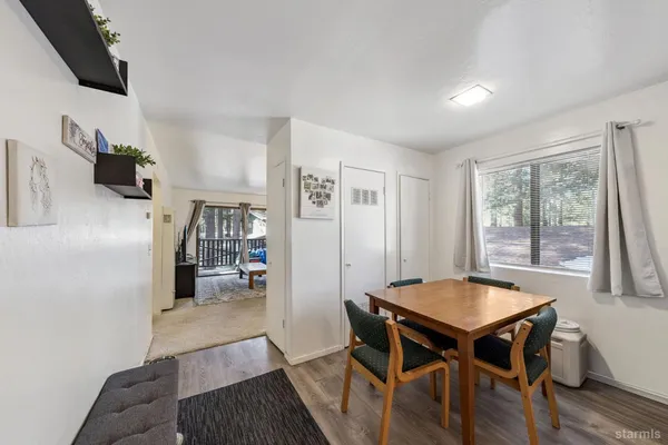 a view of a livingroom with furniture and a kitchen table