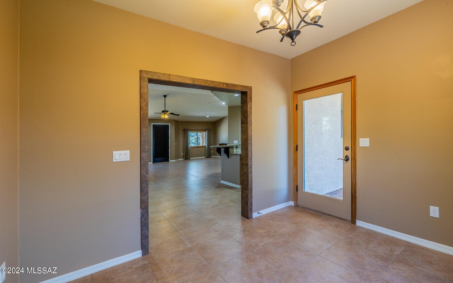 341 Sharon Road Vail, AZ 85641 - Photo 18 of 50 a view of a hallway with a chandelier