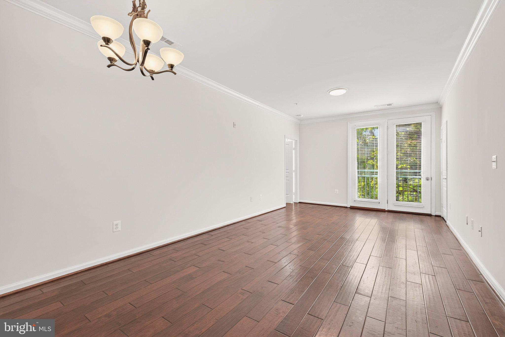 12001 Market Street, Unit 145 Reston, VA 20190 - Photo 12 of 46 Light-Filled Living Room