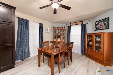 a kitchen with stainless steel appliances granite countertop a refrigerator a stove a sink and a microwave