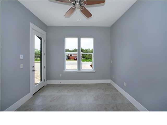228 Miami Street Miramar Beach, FL 32550 - Photo 22 of 32 a open hall with a window and a ceiling fan