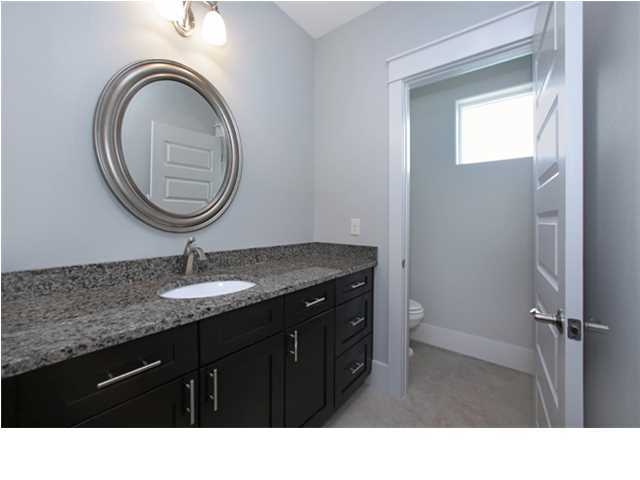 228 Miami Street Miramar Beach, FL 32550 - Photo 25 of 32 a bathroom with a sink a mirror and a toilet