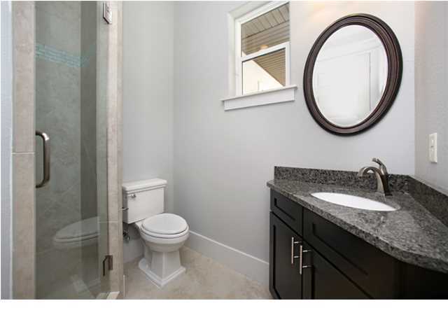 228 Miami Street Miramar Beach, FL 32550 - Photo 29 of 32 a bathroom with a granite countertop sink toilet and a mirror