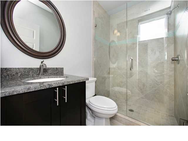 228 Miami Street Miramar Beach, FL 32550 - Photo 30 of 32 a bathroom with a sink a toilet and a mirror