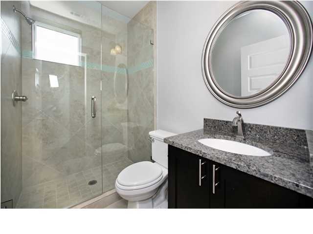 228 Miami Street Miramar Beach, FL 32550 - Photo 10 of 32 a bathroom with a sink a toilet and a mirror