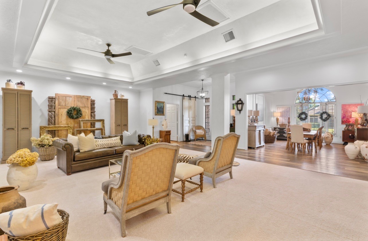 901 Longmire Road, Unit 51 Conroe, TX 77304 - Photo 1 of 48 Oversized living room area measures approximately 500 Sq Ft, (you will verify independently) Venetian plaster walls in living area. This home is unlike others in Conroe. Gorgeous fans update fo the look.