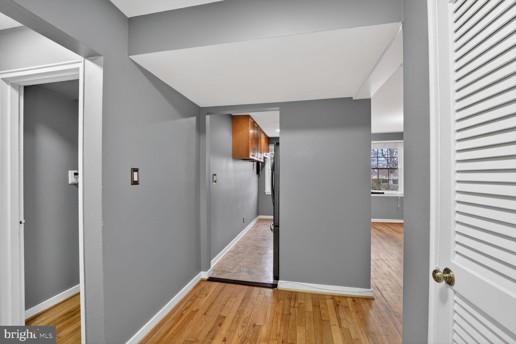 2248 Washington Avenue, Unit 101 Silver Spring, MD 20910 - Photo 16 of 23 a view of hallway with stairs and wooden floor