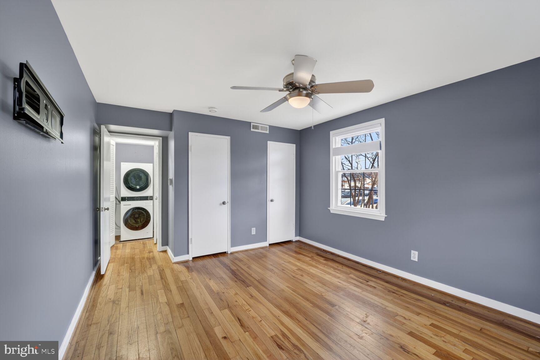 2248 Washington Avenue, Unit 101 Silver Spring, MD 20910 - Photo 18 of 23 a view of a big room with wooden floor and windows