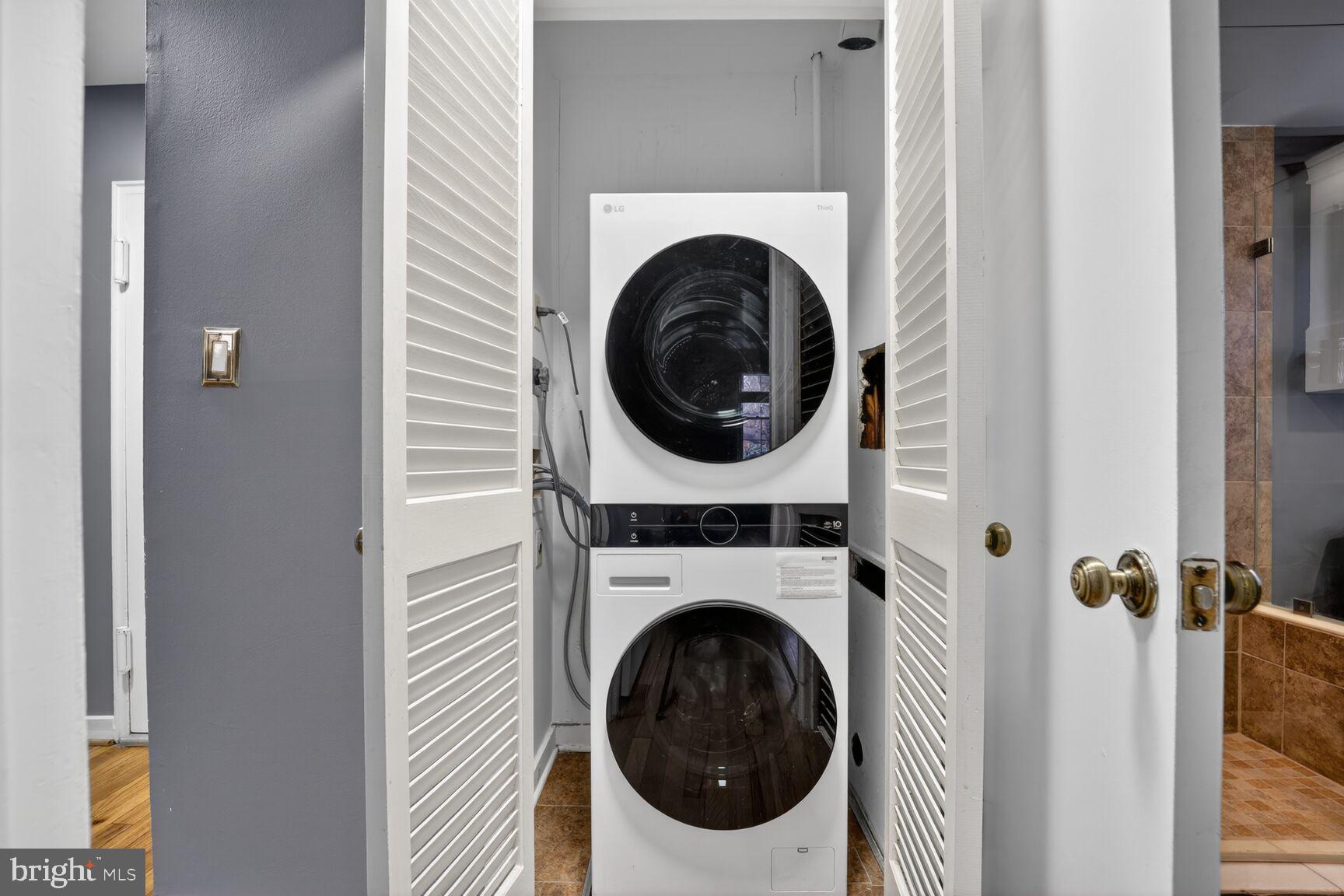 2248 Washington Avenue, Unit 101 Silver Spring, MD 20910 - Photo 19 of 23 a utility room with dryer and washer
