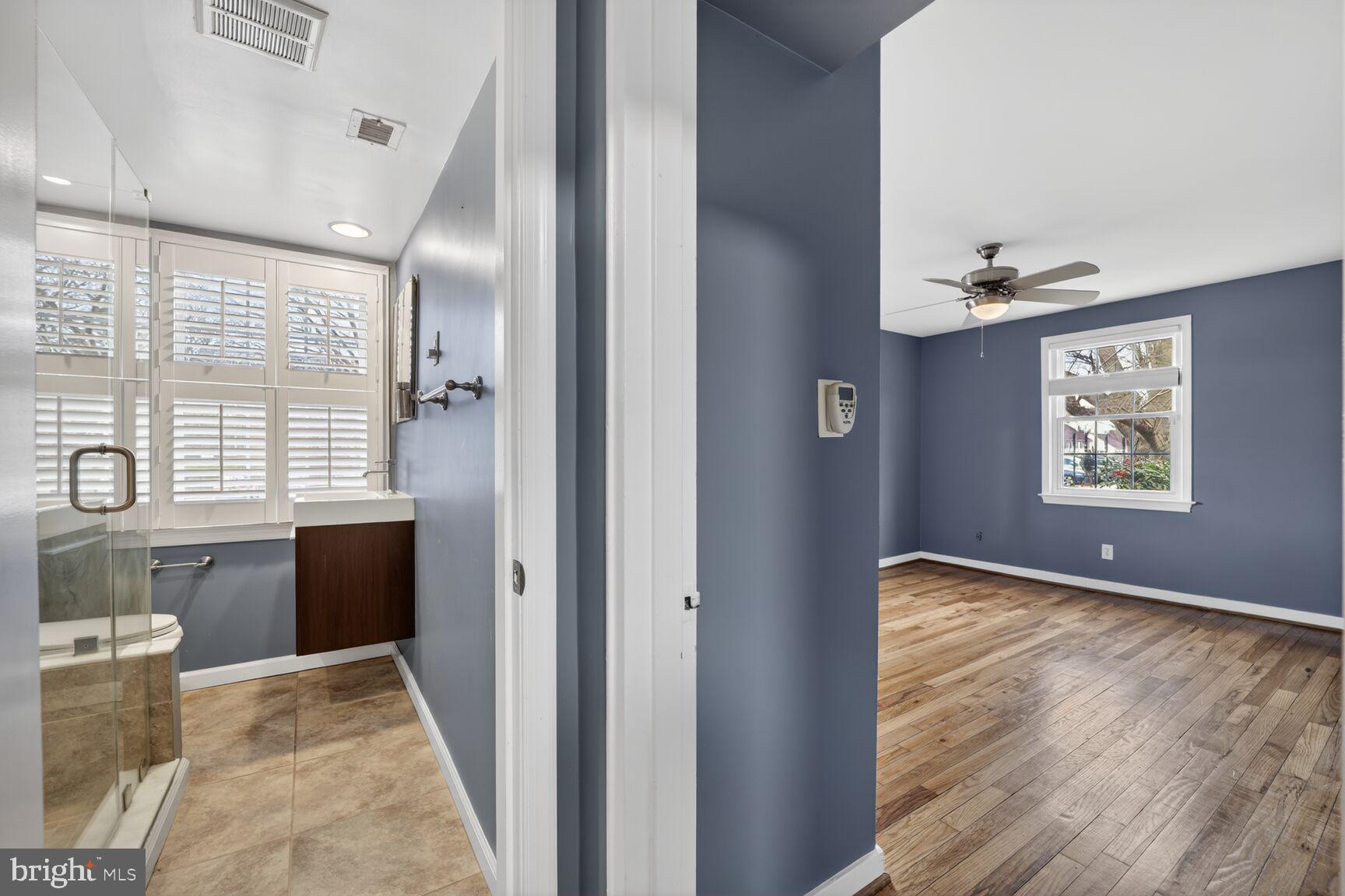 2248 Washington Avenue, Unit 101 Silver Spring, MD 20910 - Photo 20 of 23 a view of hallway with window and wooden floor