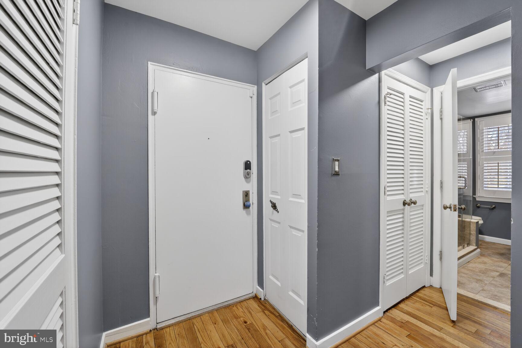 2248 Washington Avenue, Unit 101 Silver Spring, MD 20910 - Photo 3 of 23 a view of a hallway with bathroom and wooden floor