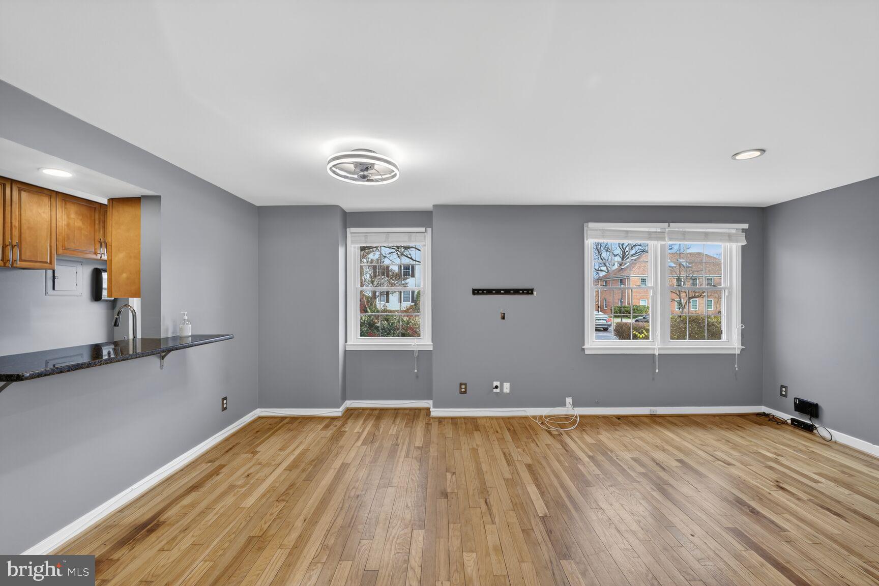 2248 Washington Avenue, Unit 101 Silver Spring, MD 20910 - Photo 4 of 23 a view of empty room with wooden floor and fan
