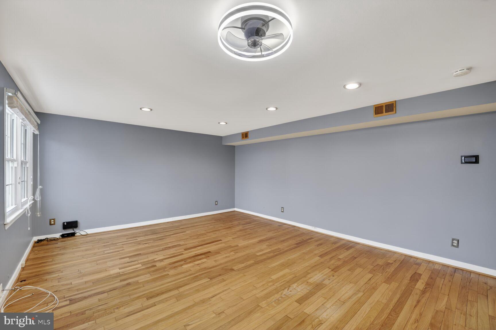 2248 Washington Avenue, Unit 101 Silver Spring, MD 20910 - Photo 8 of 23 a view of empty room with wooden floor