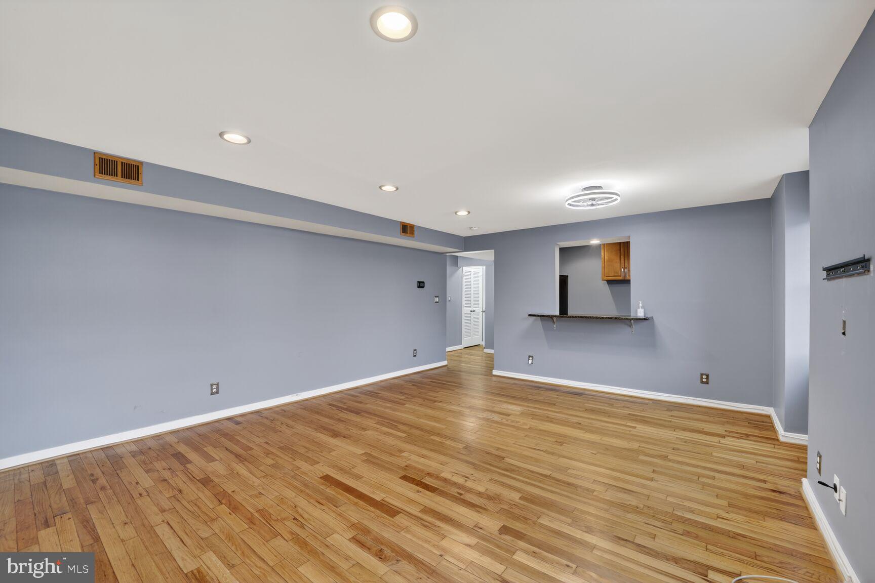 2248 Washington Avenue, Unit 101 Silver Spring, MD 20910 - Photo 9 of 23 a view of empty room with wooden floor