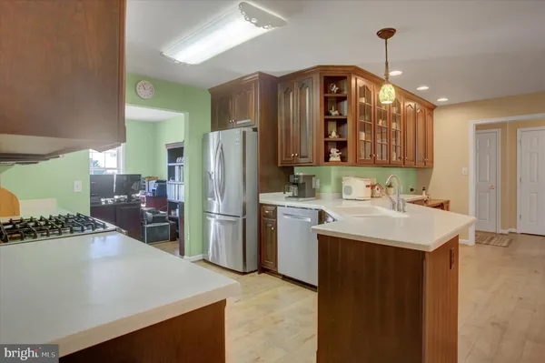 a view of a dining room with furniture and chandelier