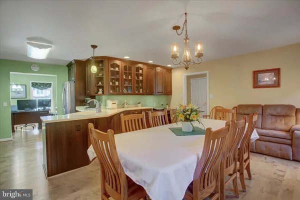a kitchen with stainless steel appliances granite countertop a stove and a sink
