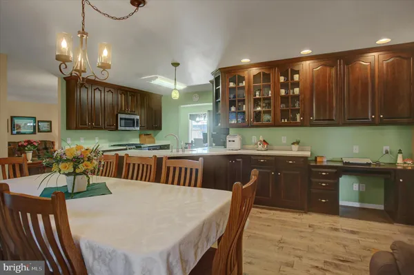 a kitchen with a sink cabinets and window